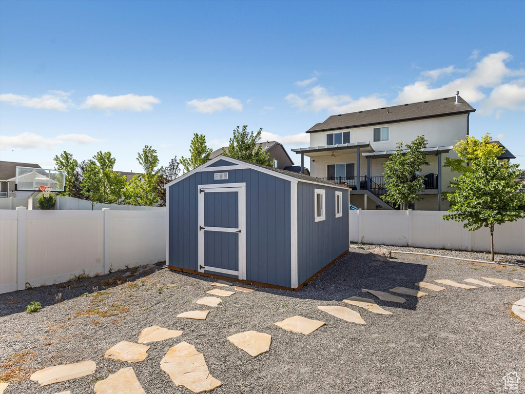 View of shed featuring a fenced backyard