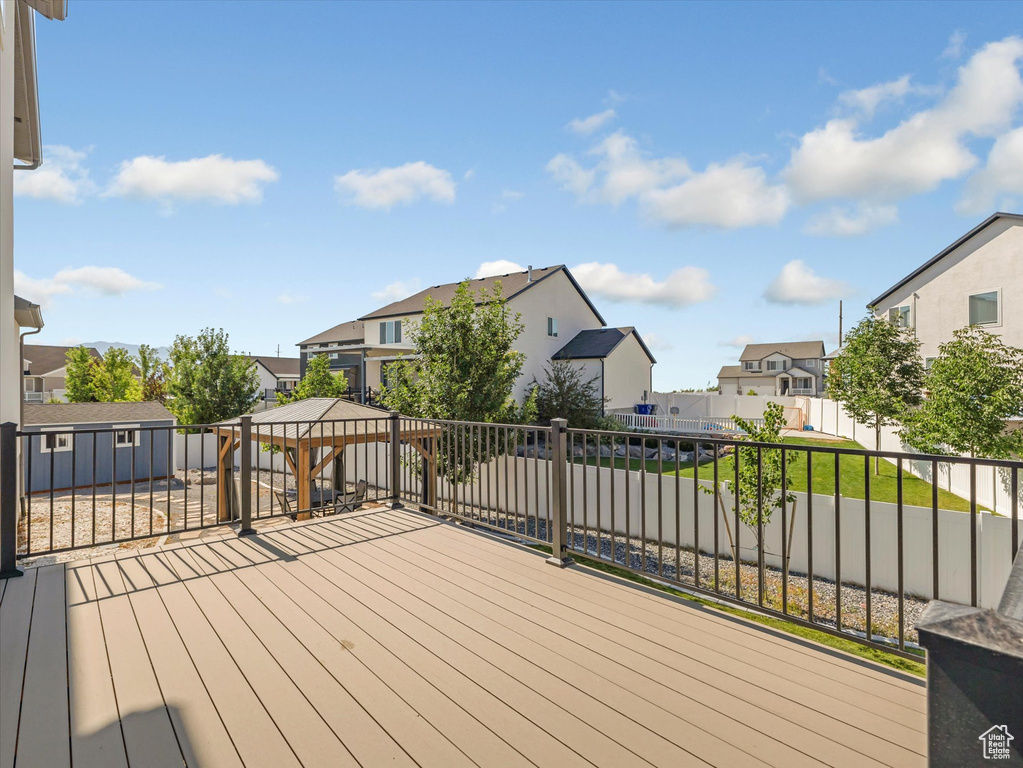 Deck featuring a residential view and a gazebo