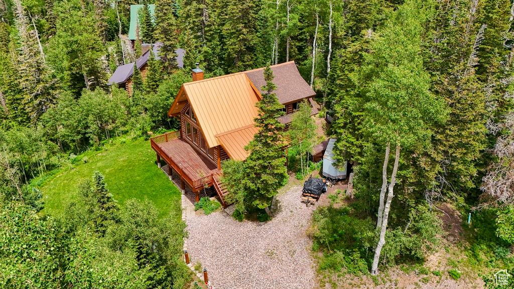 View of subject property with a heavily wooded area