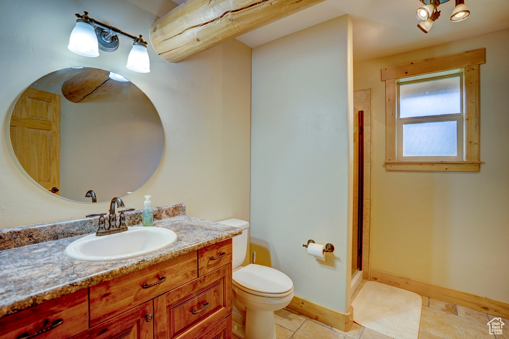 Bathroom with vanity and a shower stall