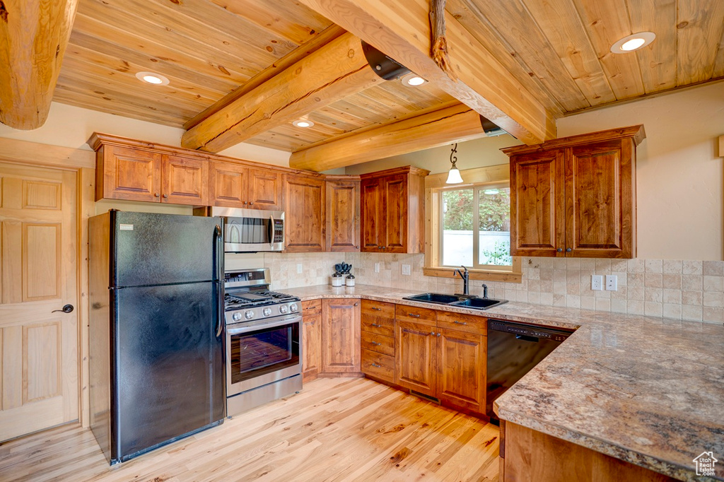 Kitchen featuring black appliances, a wood ceiling with exposed beams, light wood-type flooring, decorative backsplash, and brown cabinetry