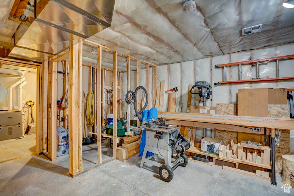 Unfinished below grade area with heating unit