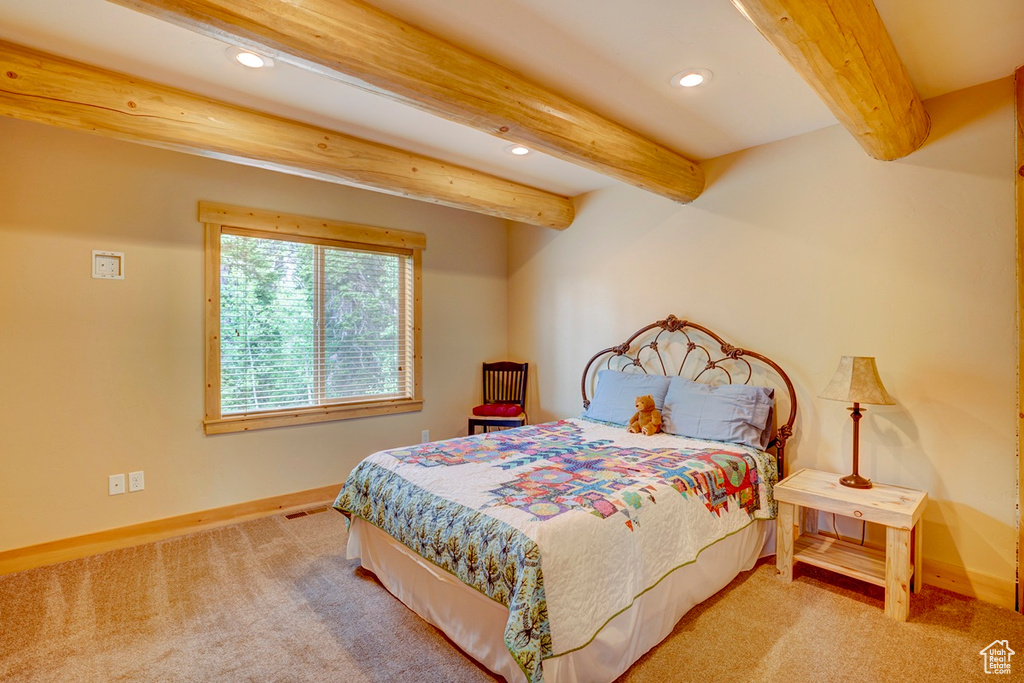 Bedroom featuring recessed lighting, beam ceiling, and carpet floors