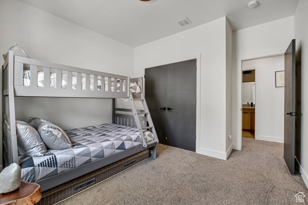 Carpeted bedroom with baseboards