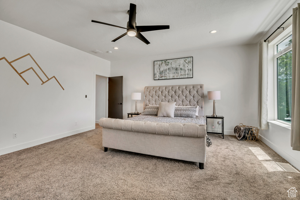 Carpeted bedroom featuring recessed lighting and ceiling fan