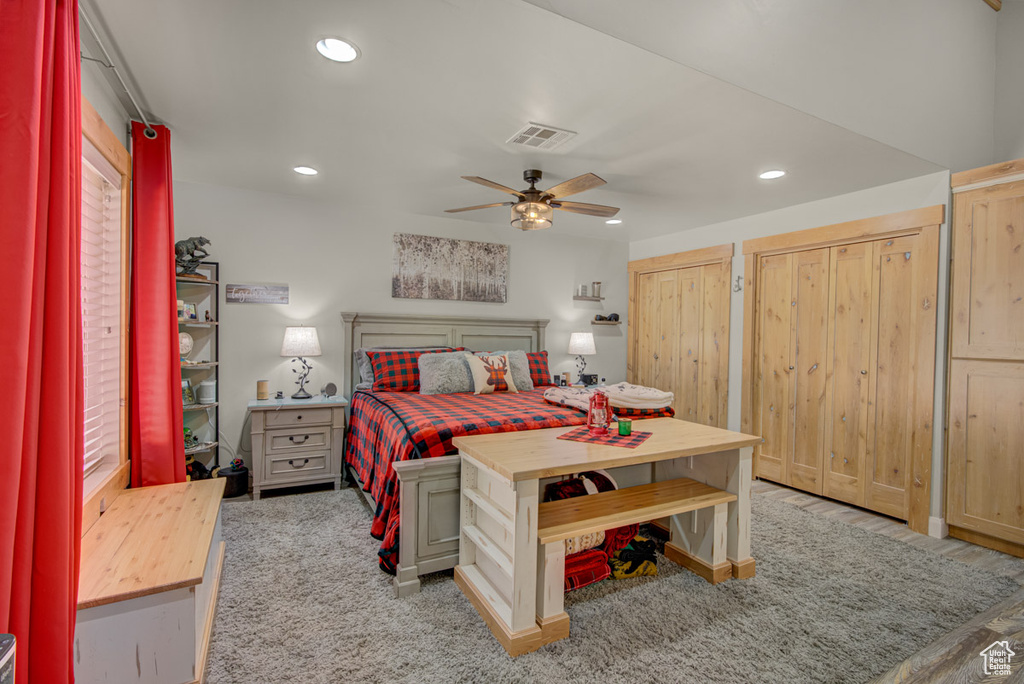 Bedroom featuring recessed lighting, two closets, and a ceiling fan