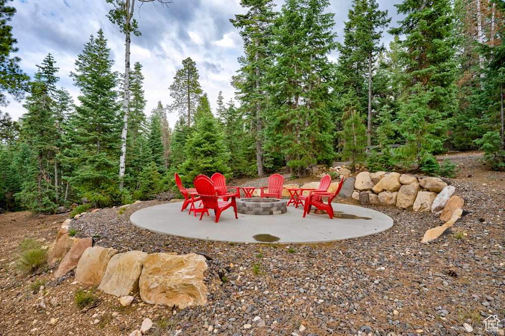 View of yard featuring a fire pit and a patio area