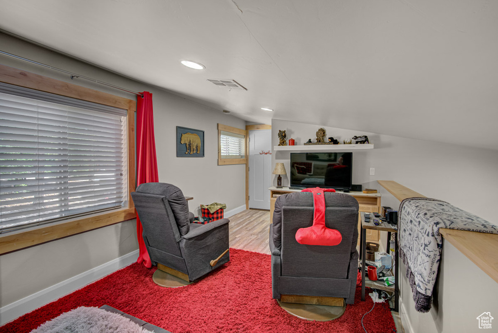 Living area with baseboards and recessed lighting