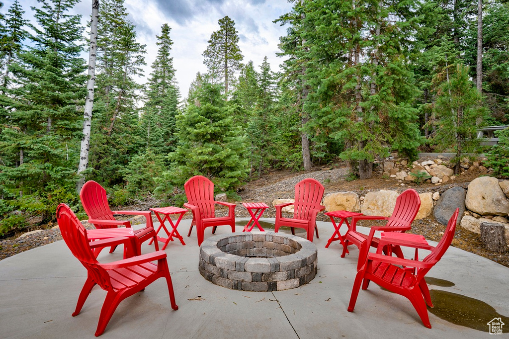 View of patio featuring an outdoor fire pit