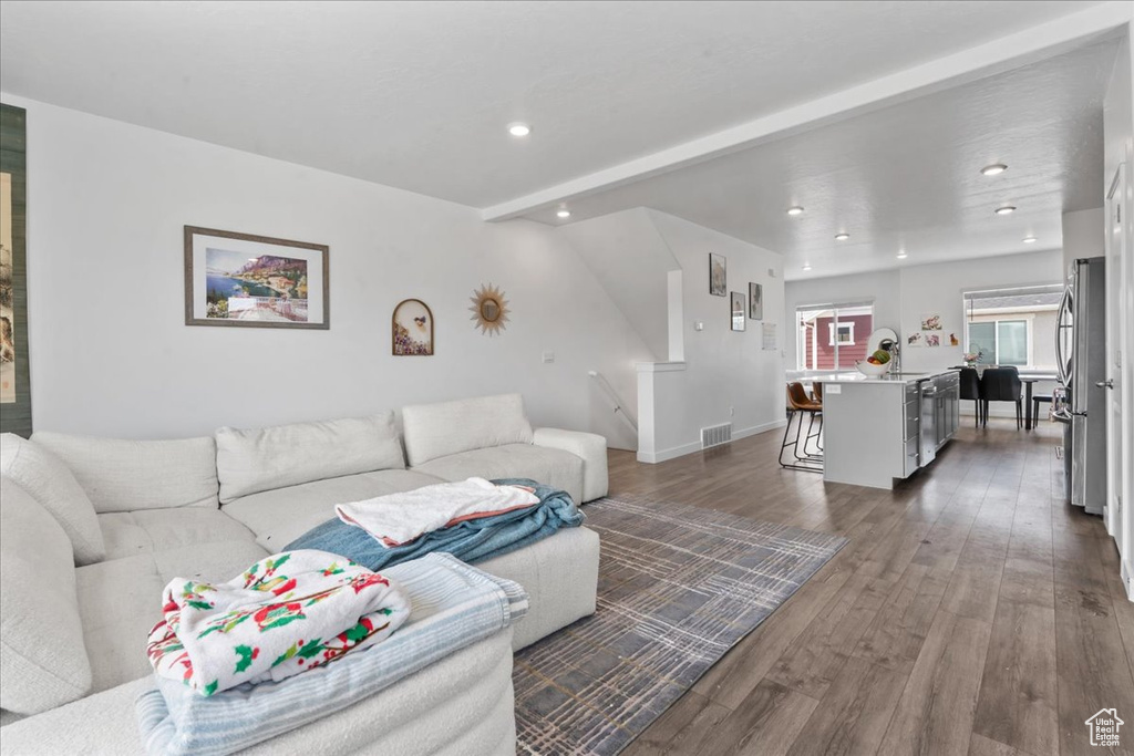 Living area with recessed lighting and wood finished floors