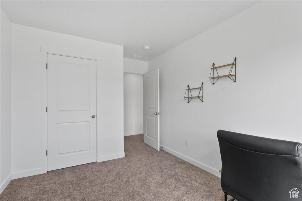 Office space featuring carpet and baseboards