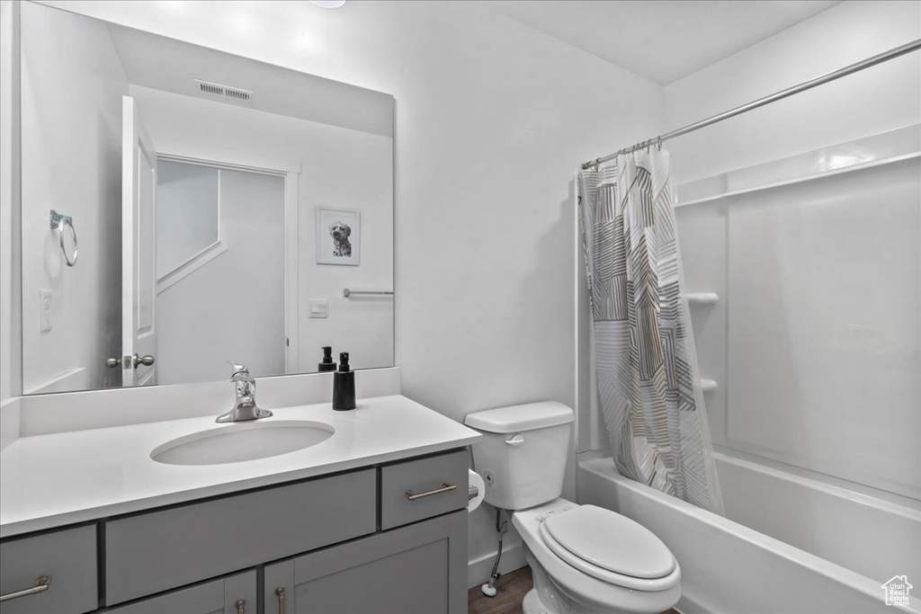 Full bath featuring shower / bath combo and vanity