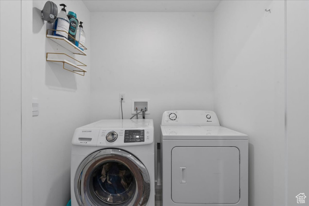 Laundry room featuring washer and clothes dryer