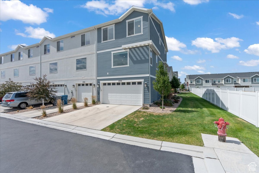 Multi unit property with a garage and concrete driveway