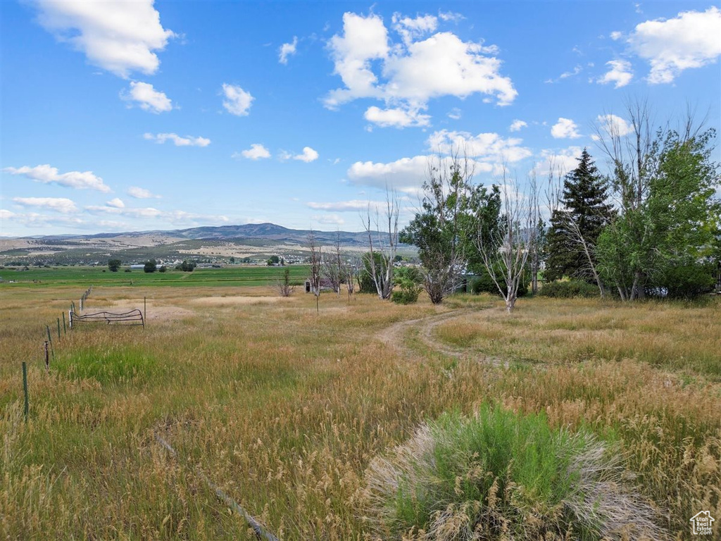 View of mountain backdrop featuring rural landscape