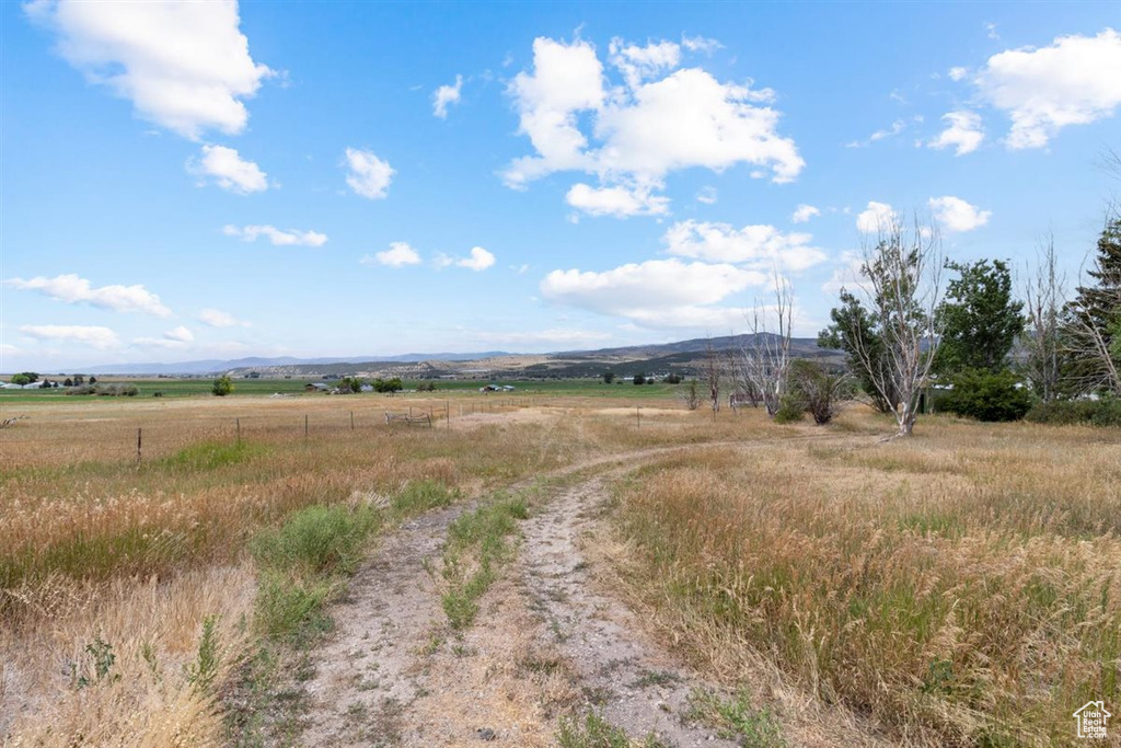 View of street with a rural view and a mountain view