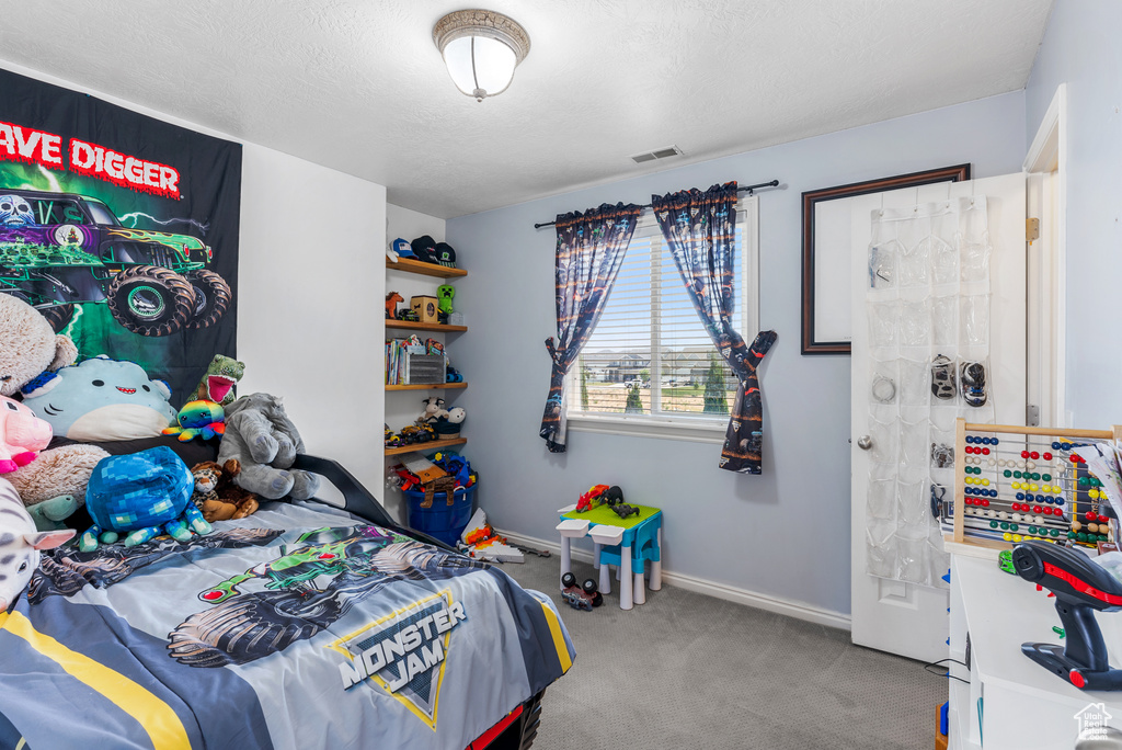 Bedroom with carpet flooring and baseboards