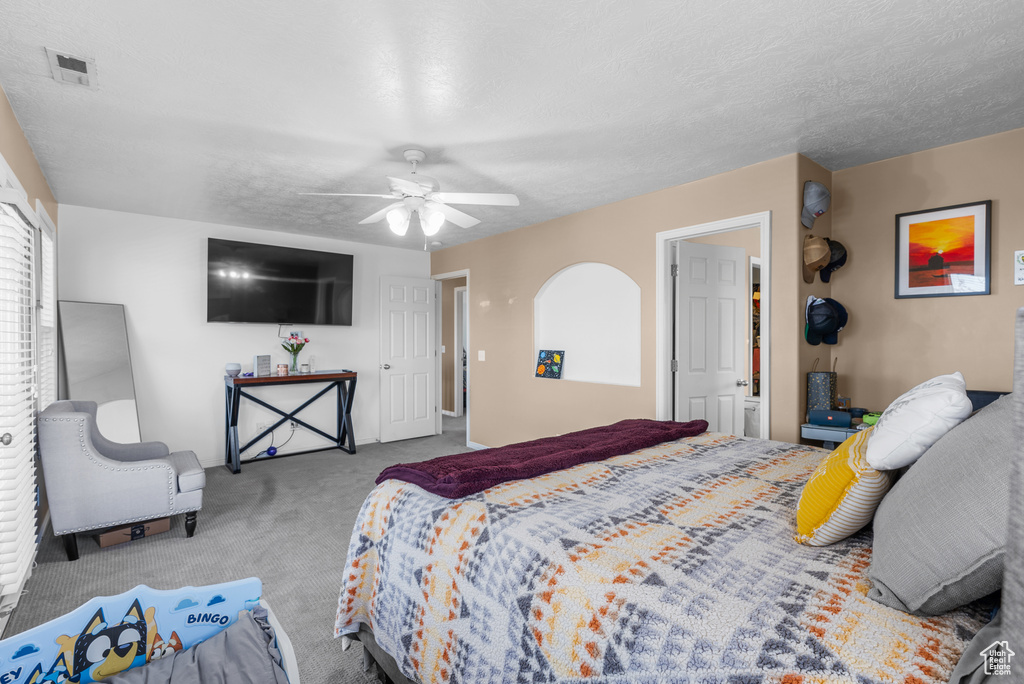 Bedroom with carpet floors and a ceiling fan
