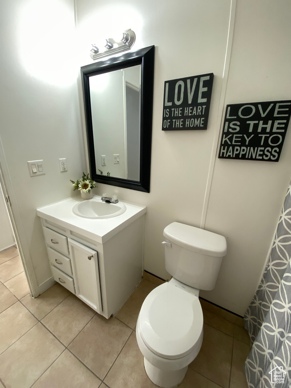 Full bathroom featuring vanity and tile patterned floors