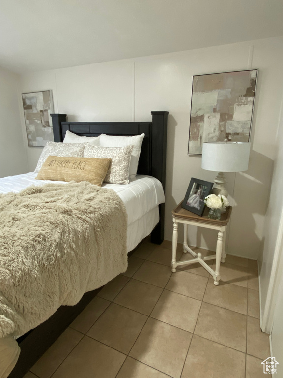 Bedroom featuring light tile patterned flooring