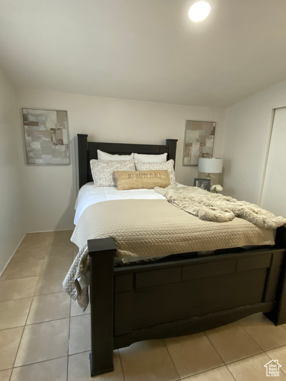 Bedroom featuring light tile patterned floors