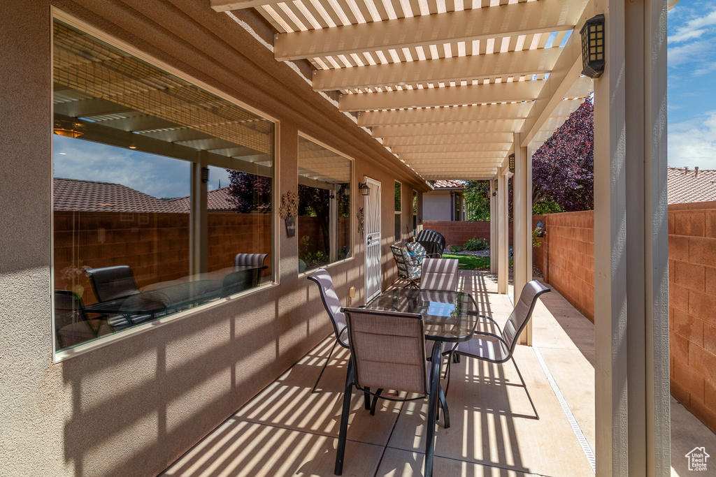 View of patio / terrace with outdoor dining area and a pergola