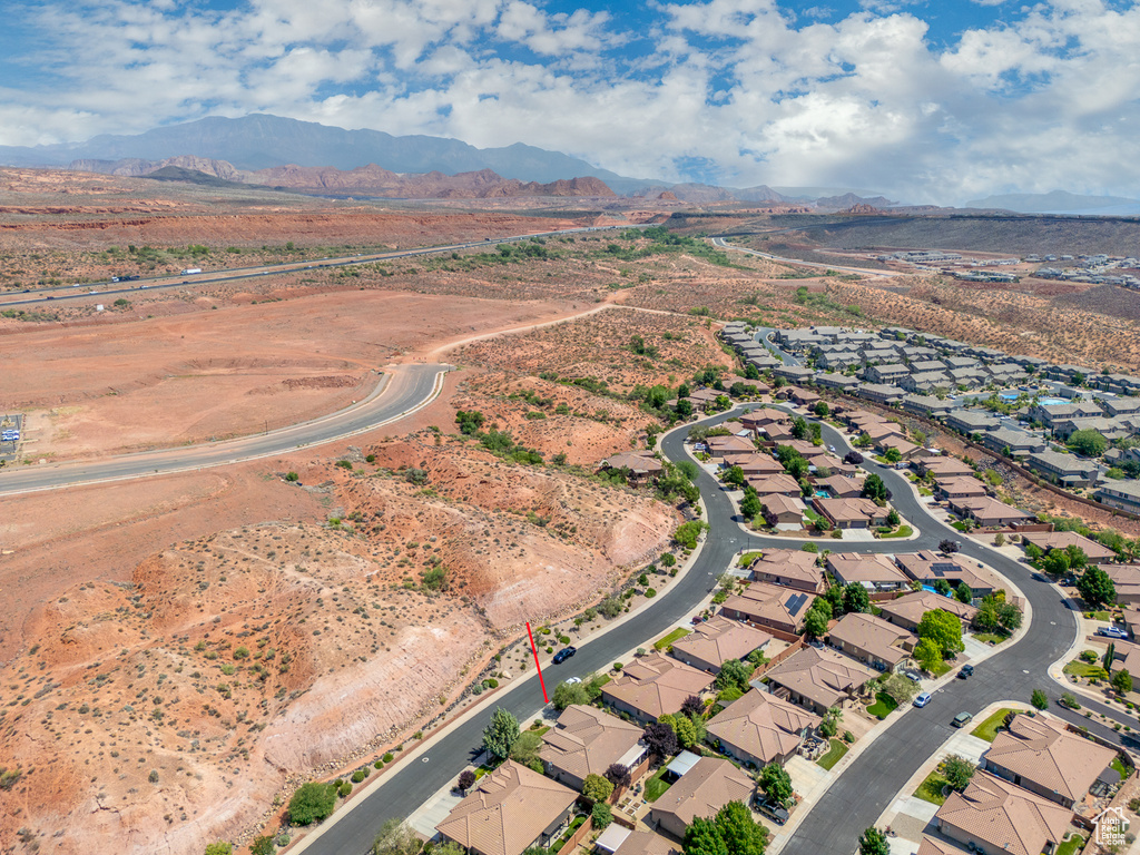 View of property location featuring a mountainous background and nearby suburban area