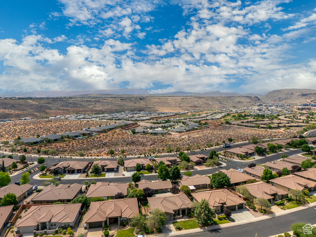 Aerial perspective of suburban area with a mountainous background