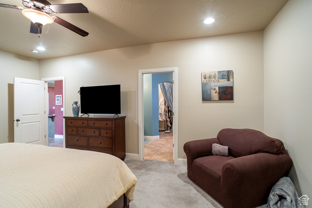 Bedroom featuring light carpet, recessed lighting, a ceiling fan, and a spacious closet