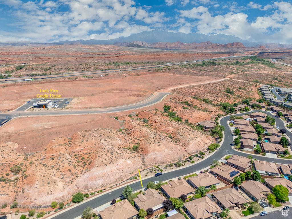 Aerial view of property's location featuring a mountain backdrop