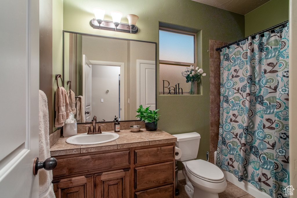 Full bath with vanity and shower / bath combination with curtain