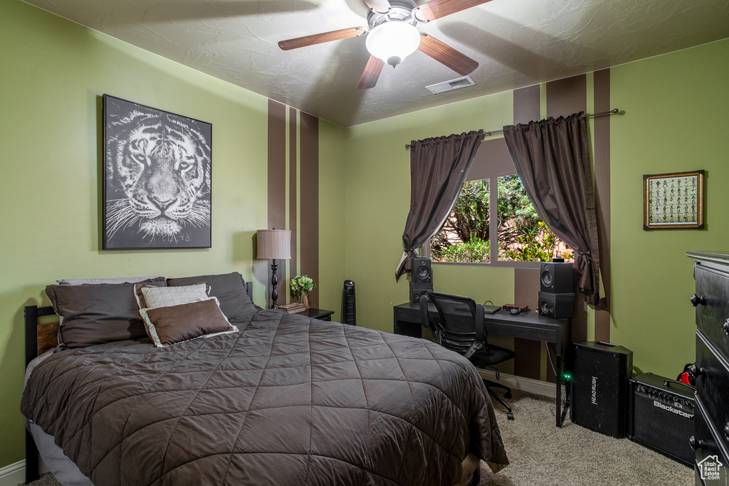 Bedroom featuring carpet flooring and a ceiling fan
