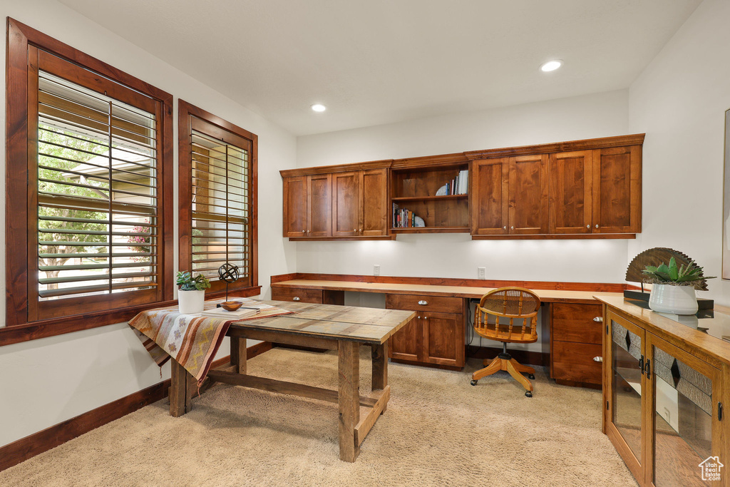 Office area with light carpet, built in study area, and recessed lighting