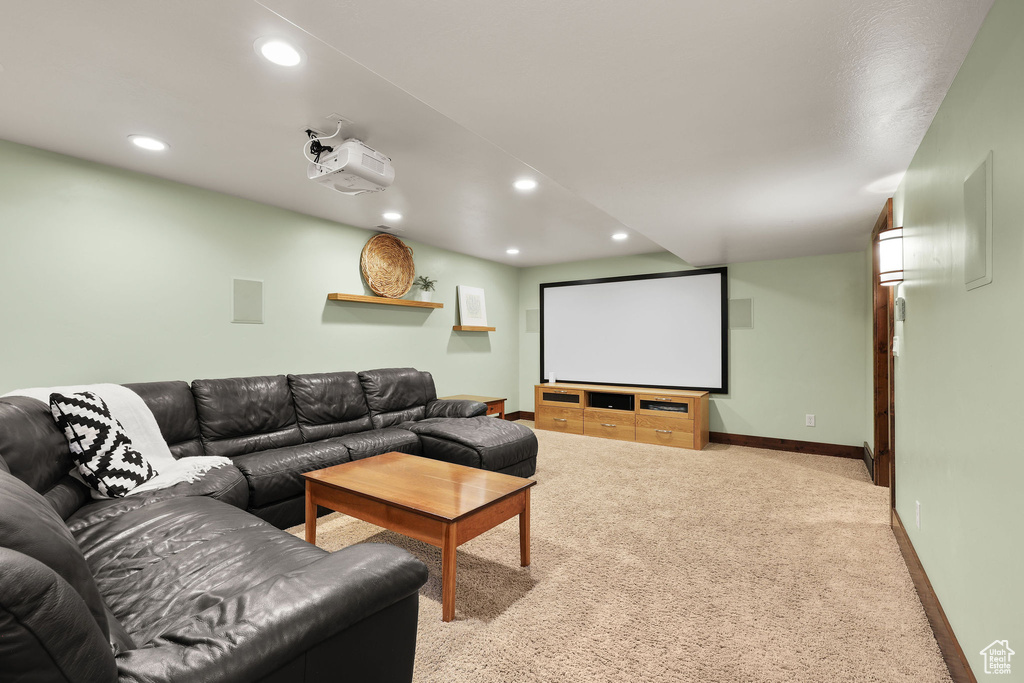 Carpeted home theater with recessed lighting