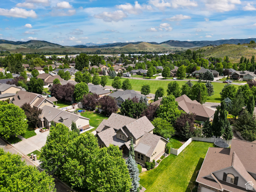 Aerial perspective of suburban area with a mountainous background