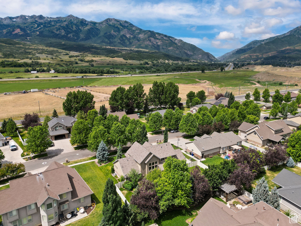 Aerial perspective of suburban area with a mountainous background