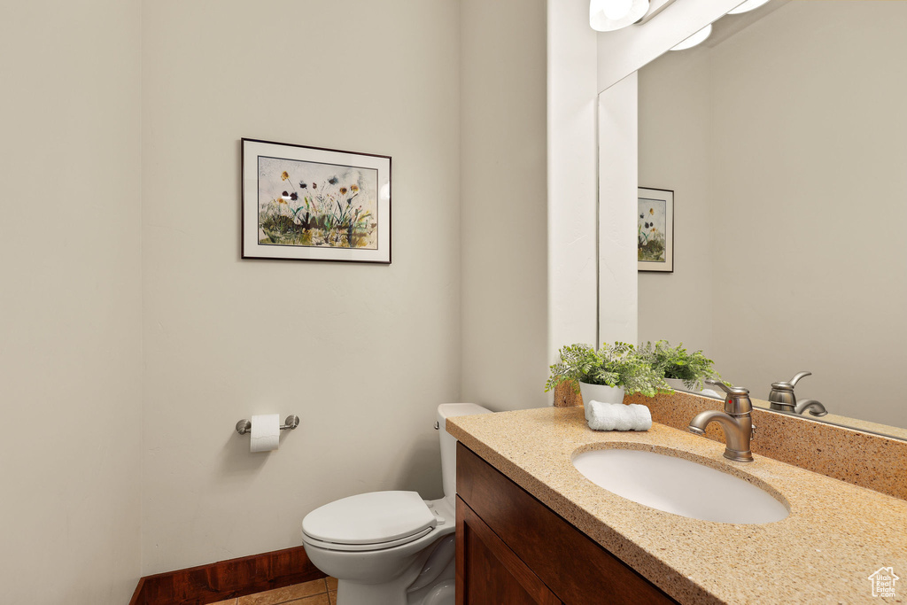 Half bath with toilet and vanity