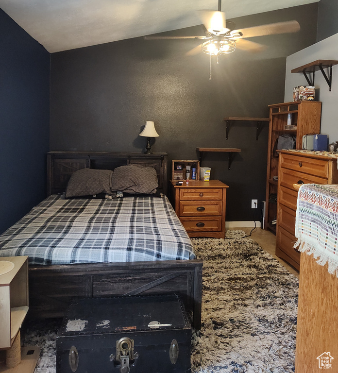 Carpeted bedroom with ceiling fan