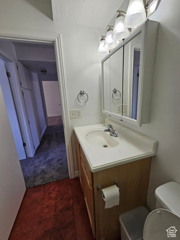 Bathroom with vanity and a textured ceiling