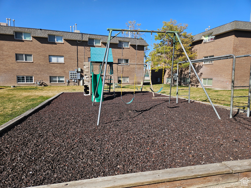 Community jungle gym featuring a lawn