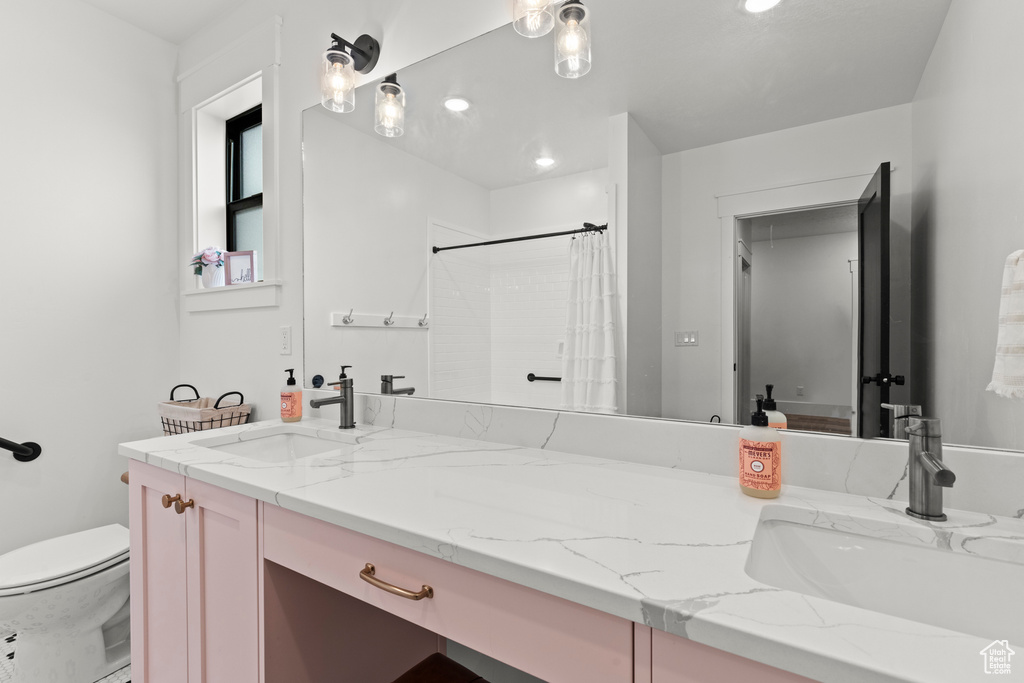 Bathroom featuring vanity, a shower with curtain, and recessed lighting