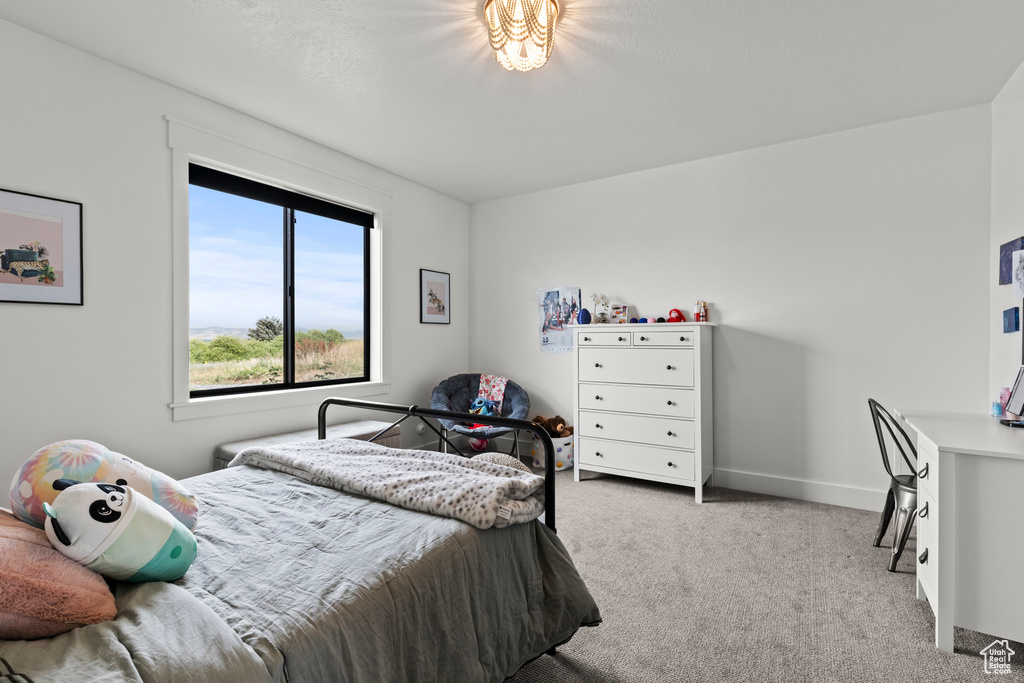 Bedroom with carpet and baseboards