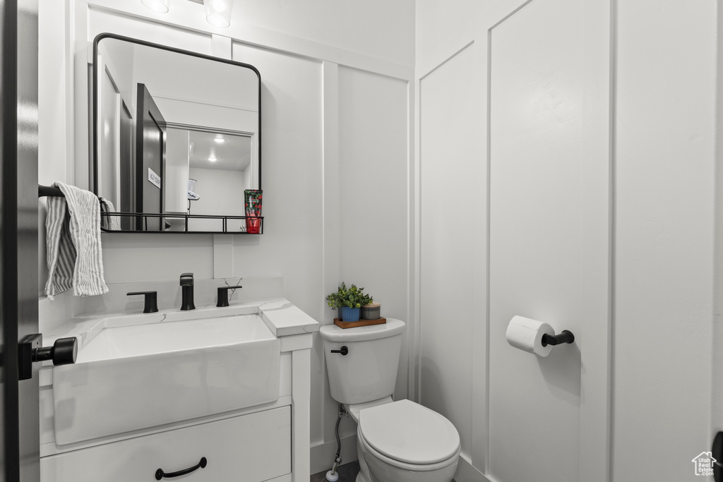 Half bath with toilet and vanity