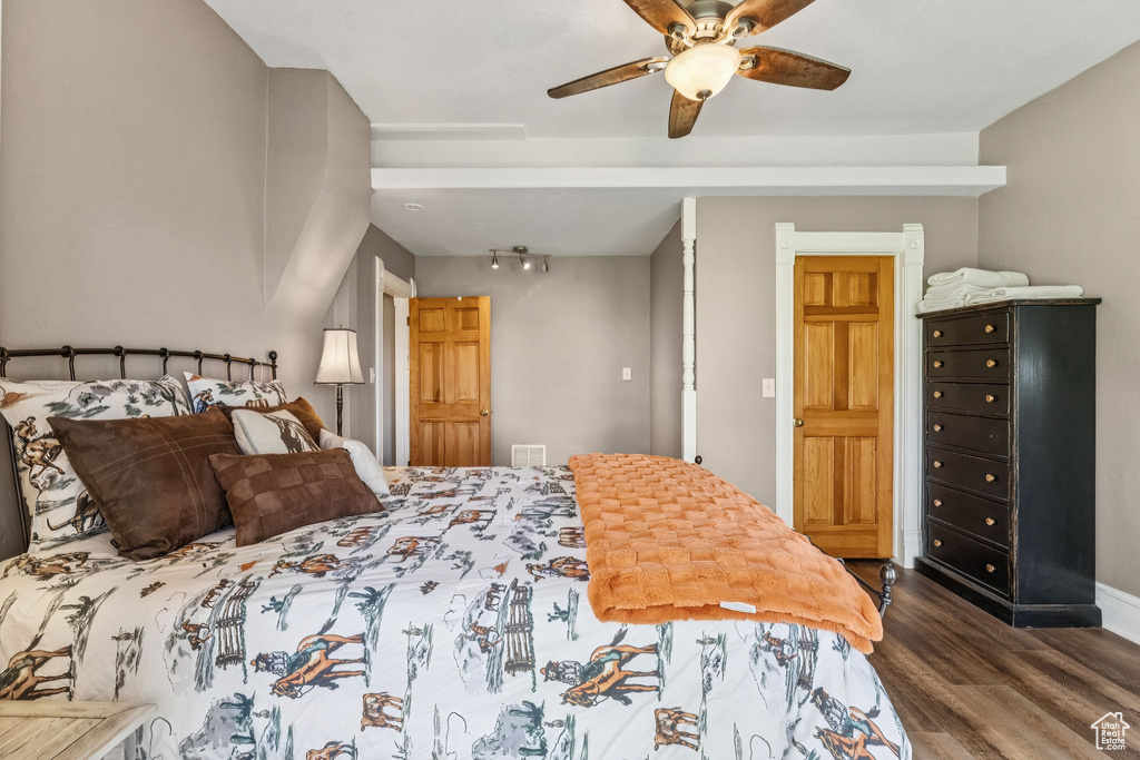 Bedroom featuring wood finished floors and ceiling fan