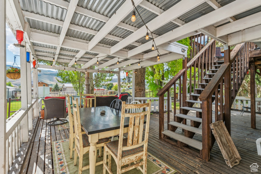 Deck with stairs and outdoor dining area