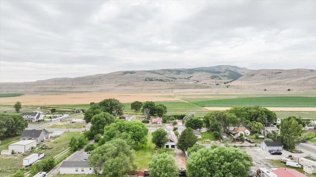 Aerial overview of property\\\'s location with a mountain backdrop and rural landscape