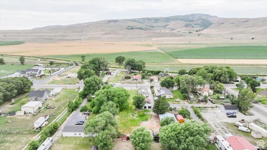 Aerial view of sparsely populated area with a mountain backdrop