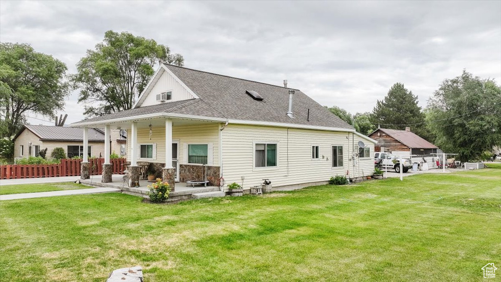 Rear view of house with roof with shingles