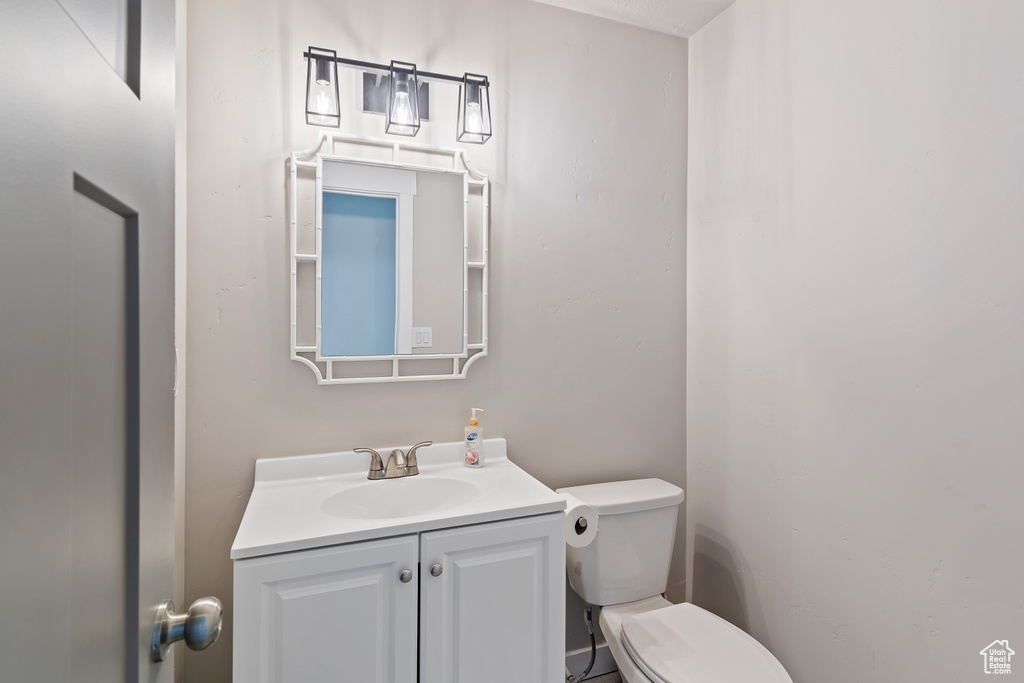 Bathroom featuring toilet and vanity