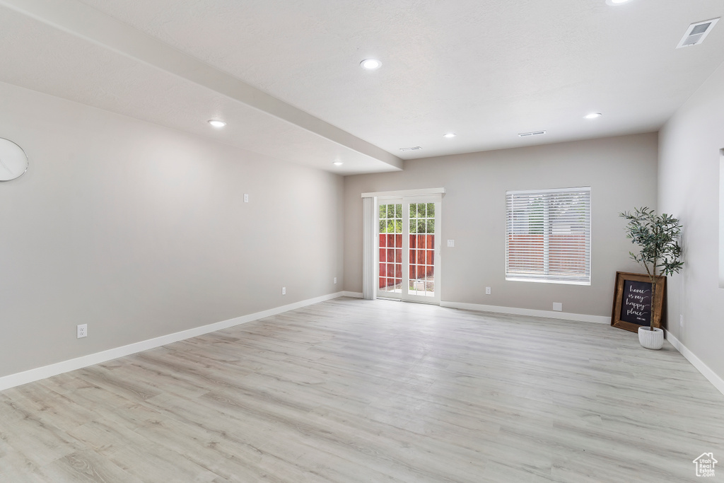 Spare room with light wood-style flooring and recessed lighting